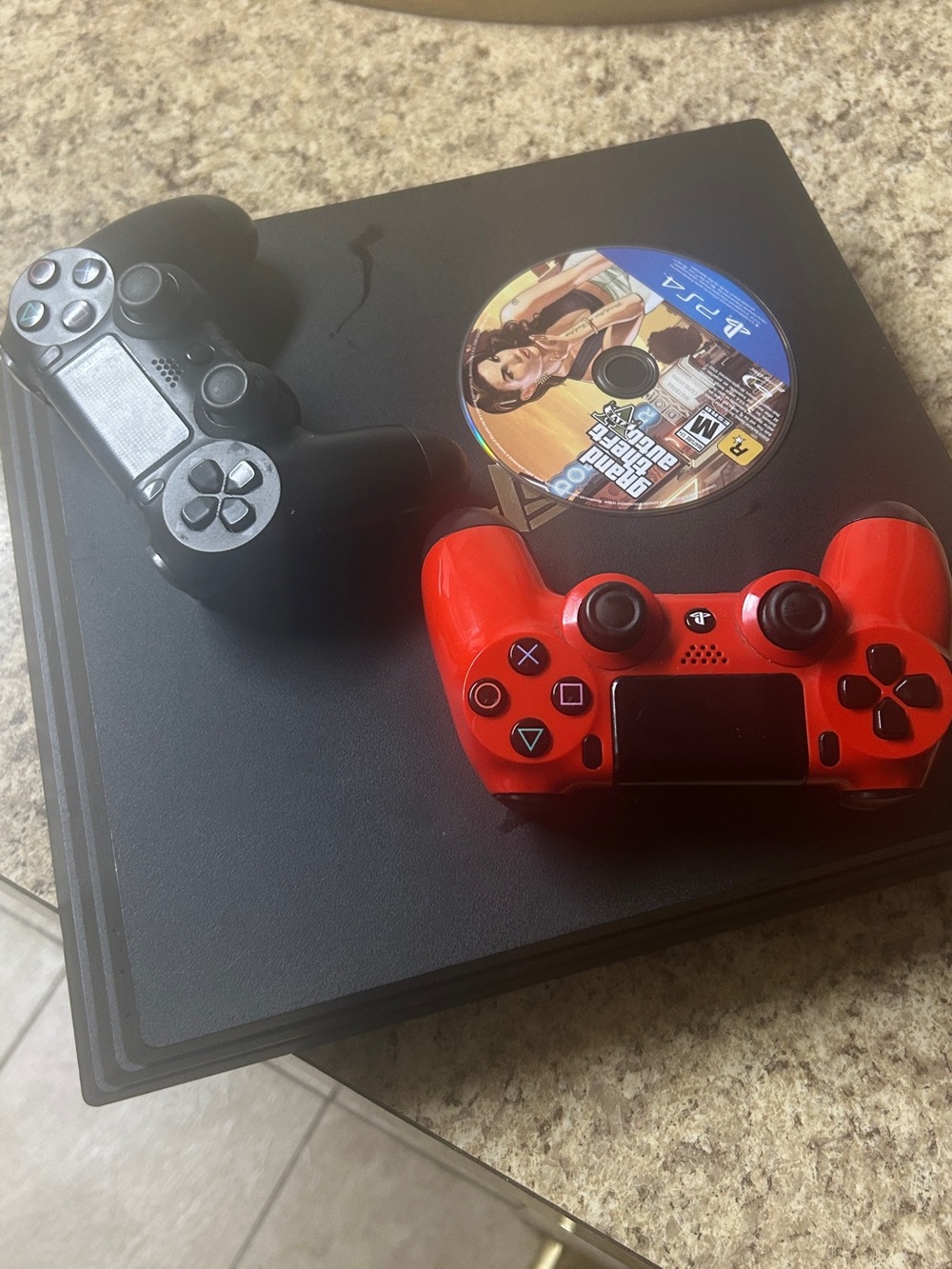 Sony PS4 Slim Console with Red and Black DualShock Controllers